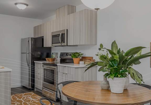 The Tides at Willow Point Apartments Model Kitchen and Dining Area