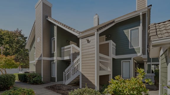 A modern two-story house with a balcony on the second floor. at AVIA Lofts on Parkway, Vancouver, WA