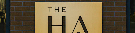 the logo restaurant on a brick wall