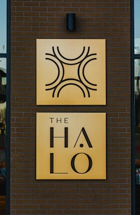 the logo restaurant on a brick wall