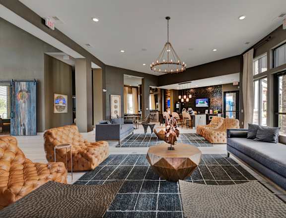 a lobby with couches and chairs and a table