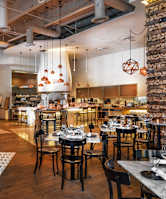 a restaurant with tables and chairs and a large dining room