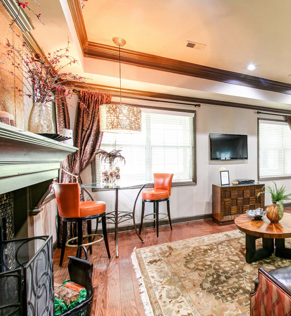 a living room with a couch and chairs and a fireplace