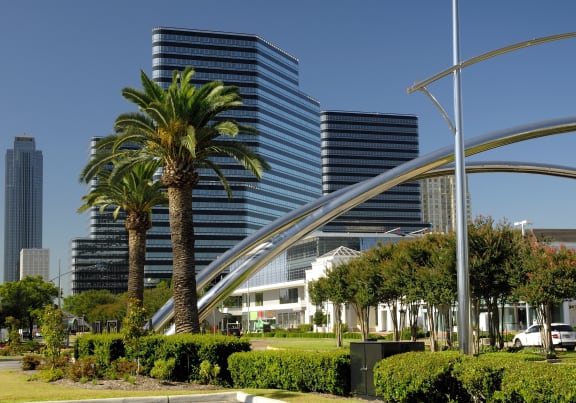 a view of a city with palm trees and skyscrapers at Stone Creek at Old Farm Apartments, Houston, 77063