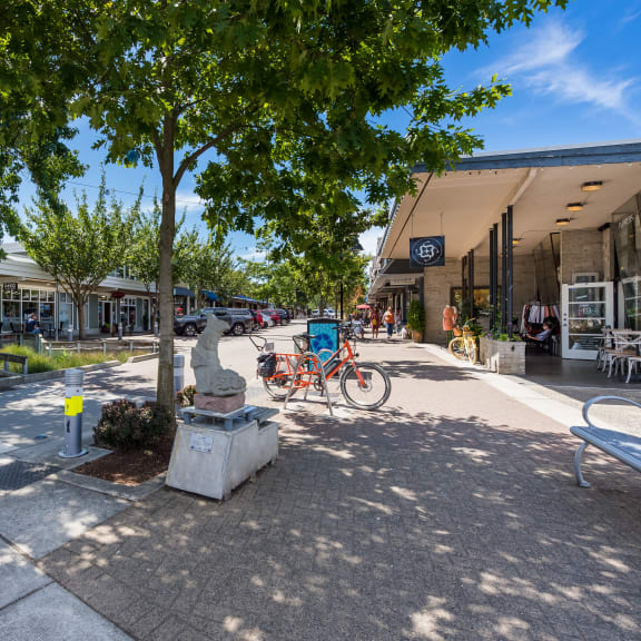 a parking lot with bikes in front of a building
