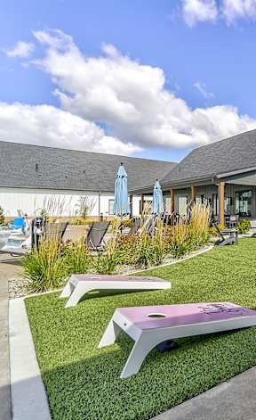 a lounge area with couches and chairs and tables at The BLVD at Wilson Crossings, Michigan, 49418