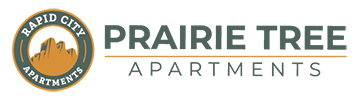 The image is a logo for Prairie Tree Apartments.