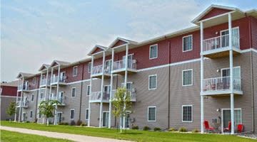 an exterior view of an apartment building with balconies