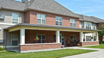 a large brick house with a tower on top of it