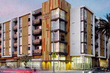 a rendering of an apartment building on a city street