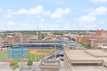 a view of a baseball stadium from the roof of a building