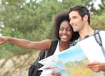 A man and woman are looking at a map together.