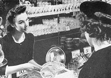 a woman standing in a grocery store buying food at Market Square Place, Pittsburgh, PA, 15222
