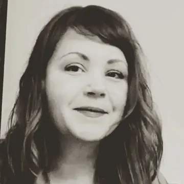 a portrait of a woman with long hair