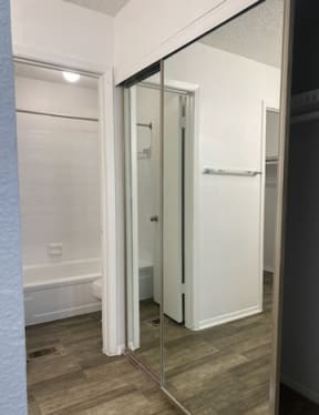 a bathroom with a shower and a mirror