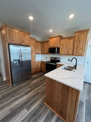 A kitchen with wooden cabinets and a white countertop.