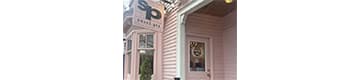 A storefront with a sign that says "sp" on it.