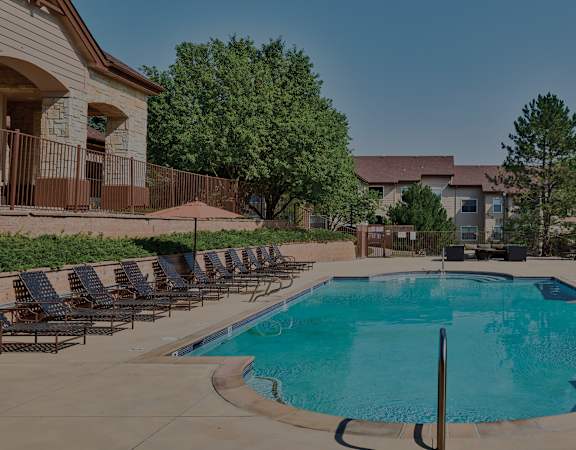 Grand Centennial - Resort-style swimming pool with lounge seating