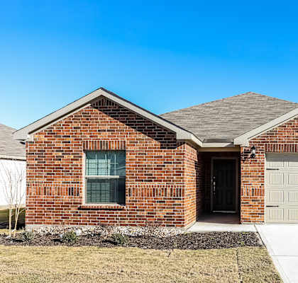 a brick house with a white garage door