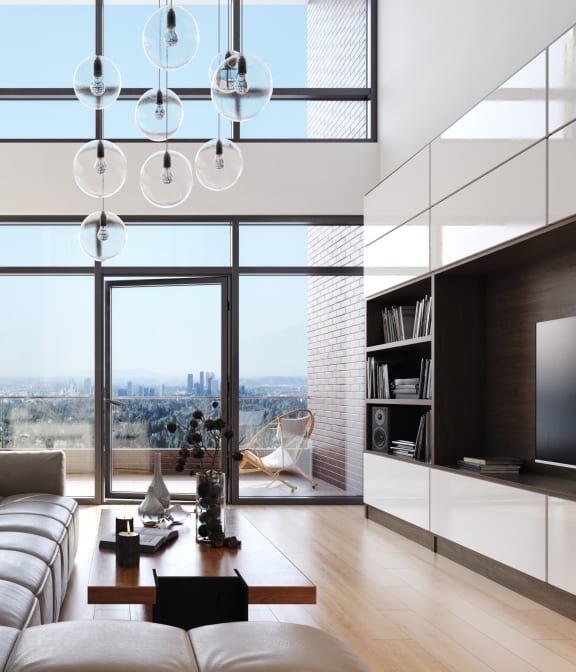 a living room with a large window and a couch and a table