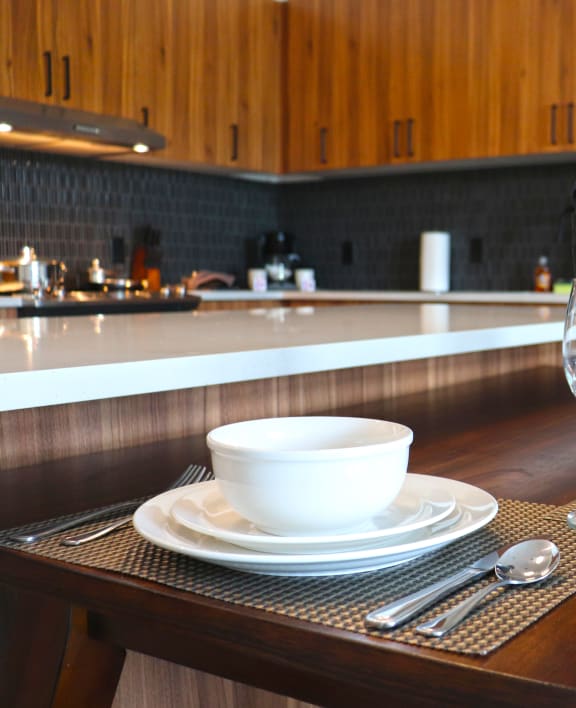 a dining table with dishes and glasses in a kitchen at Wildhorse Apartments, Missouri, 63017