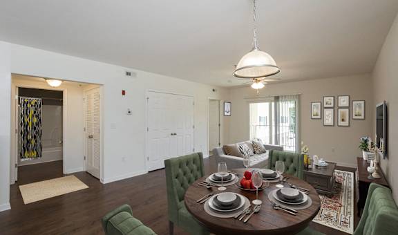 an open living room and dining room with a table and chairs at Lakecrest Apartments, PRG Real Estate Management, Greenville, South Carolina