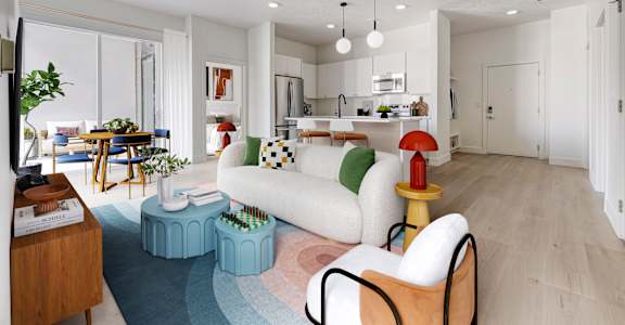A modern living room with a white sofa, a wooden side table, and a blue rug.