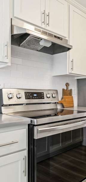 A kitchen with a stove, oven, and refrigerator at Bridge City, Portland Oregon