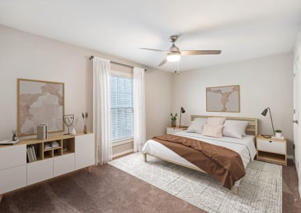 a bedroom with a bed and a ceiling fan at Lake Johnson Mews Apartments, PRG Real Estate Management, Raleigh, 27606