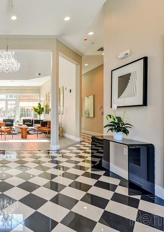 A black and white checkered floor in a spacious room.