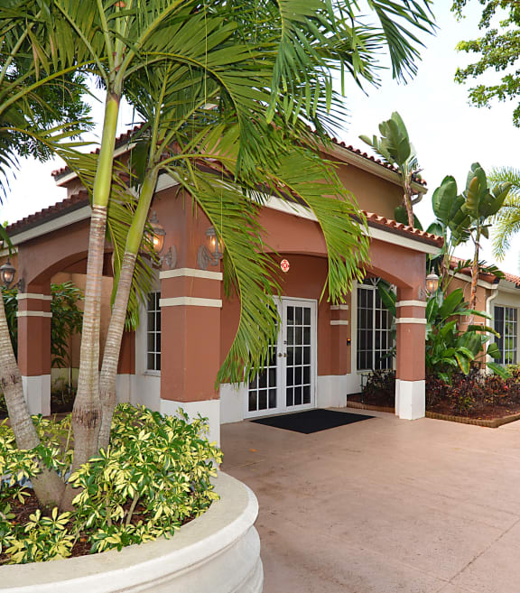 a house with palm trees in front of it