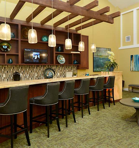 a living room with a bar and a couch