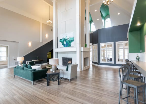 a living room with couches and chairs and a fireplace