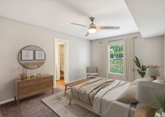 a living room with a couch and a ceiling fan at Lake Johnson Mews Apartments, PRG Real Estate Management, Raleigh, 27606