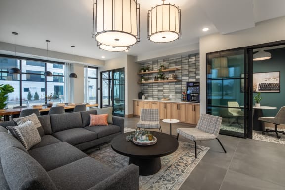 a living room with a gray couch and a coffee table