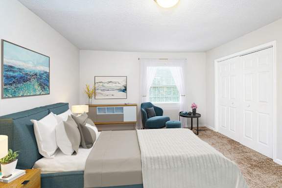 A bedroom with a bed, a chair, and two paintings on the wall.
