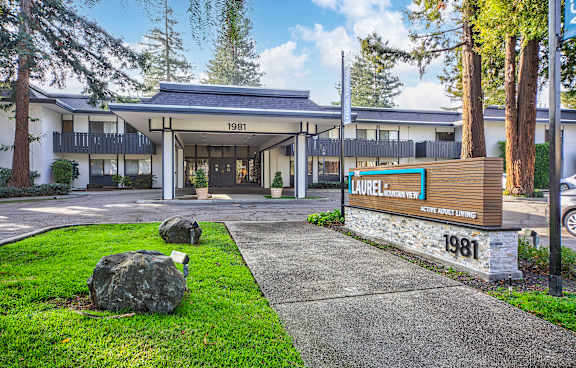 The image shows a building with the number 1981 on it and a sign that reads "Laurelwood Inn".