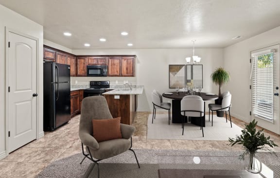 a living room and kitchen with a table and chairs