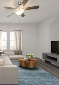 A living room with a green couch and a coffee table.