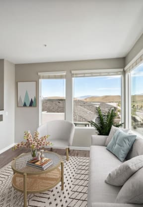 a living room with a couch and a coffee table and a television at Lumina at Spanish Springs, Sparks, NV