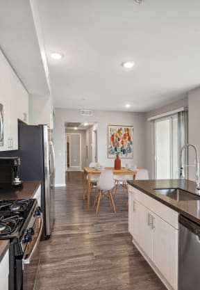a kitchen and living room with a stove and a sink at Lumina at Spanish Springs, Sparks, NV