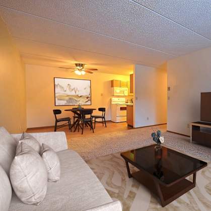 a living room with a couch and a coffee table and a tv at France, Fargo North Dakota