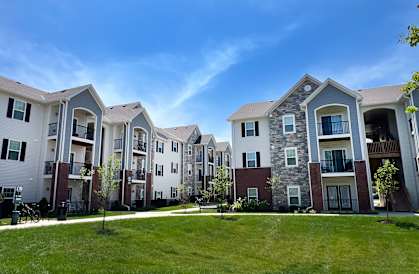 a row of apartment buildings on a sunny day