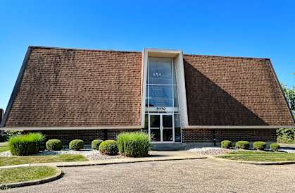 the front of a brick building with a glass door  at The Wynds, Kettering, OH, 45429
