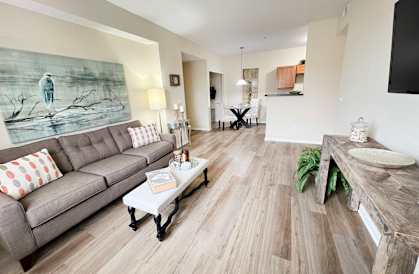 a living room with a couch and a table at Residences at Northgate Crossing, Columbus, OH