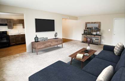 a living room with a couch and a coffee table  at Crown Court Apartments, Florence, KY