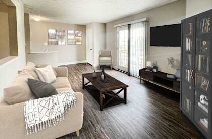 a living room with a couch and a table at 450 on Keeneland Apartments, Minnesota