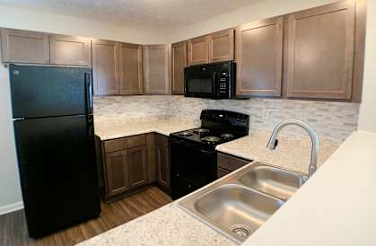 a kitchen with black appliances and granite counter tops  at Aberdine Place, Kentucky