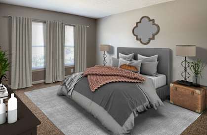 a bedroom with a bed and two windows  at Knobs Pointe Apartments, New Albany, Indiana