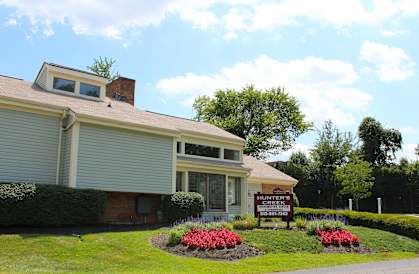 a house with a sign in front of it  at Hunter's Creek Apartments, Cincinnati, 45242